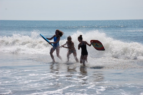 Cousins in surf.